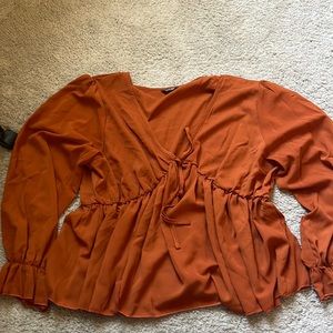 Orange peplum blouse